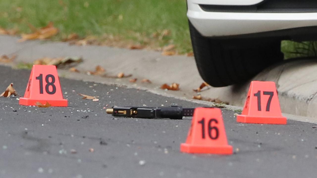 Homicide detectives placed markers where the bullet casings and a firearm were found in the street. Picture: NewsWire / David Crosling