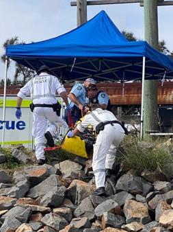 Police remove the diver’s body from the water. Picture: NSW Police.