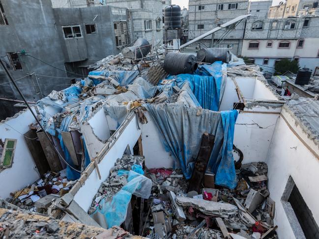 Palestinian citizens inspect the destruction caused by air strikes on their homes in Khan Yunis, Gaza. Picture: Getty Images