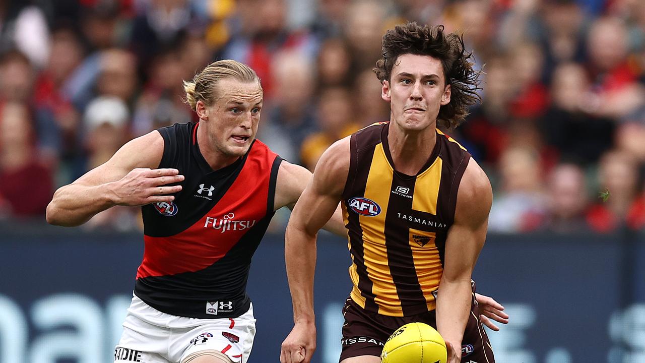 Adelaide, Australia. 03rd June, 2023. Conor Nash of the Hawks is tackled by  Dan Houston and Riley Bonner of the Power during the AFL Round 12 match  between the Port Adelaide Power