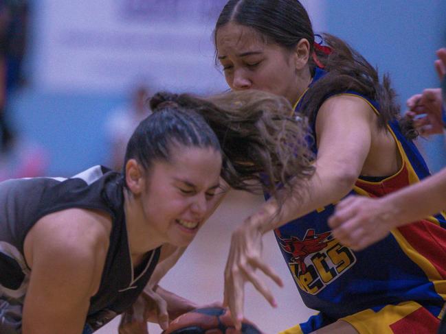 Lightning standout Dom Carbone fights for possession before her team went on to win its third consecutive DBA Women’s Championship final against Tracy Village Jets last night. Picture: Glenn Campbell