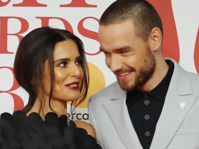 British singer-songwriter Liam Payne (R) and partner Cheryl pose on the red carpet on arrival for the BRIT Awards 2018 in London on February 21, 2018. / AFP PHOTO / Tolga AKMEN / RESTRICTED TO EDITORIAL USE – NO POSTERS – NO MERCHANDISE– NO USE IN PUBLICATIONS DEVOTED TO ARTISTS