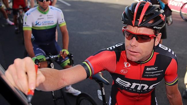 BMW Racing cyclist Cadel Evans signs on before the criterium curtain-raiser for the Tour Down Under.