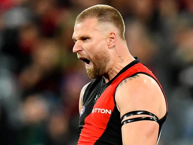 MELBOURNE, AUSTRALIA – JUNE 29: Jake Stringer of the Bombers celebrates kicking a goal during the round 16 AFL match between Geelong Cats and Essendon Bombers at Melbourne Cricket Ground, on June 29, 2024, in Melbourne, Australia. (Photo by Josh Chadwick/AFL Photos/via Getty Images)