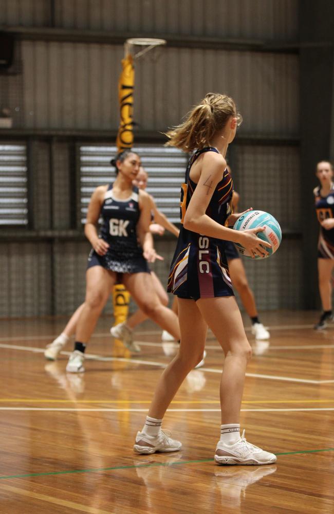 Netball action at QISSN 2024. Canterbury College v Good Shepherd Lutheran College