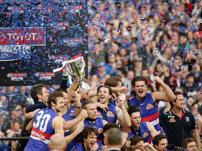 The Bulldogs lift the 2016 premiership cup after a 62-year wait. Picture: Colleen Petch.