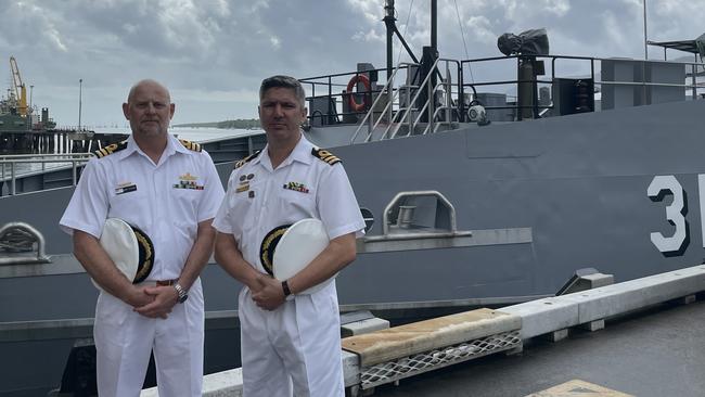 HMAS Cairns new Commanding Officer Andrew Thorpe with outgoing commander Alfonso Santos. Photo: Dylan Nicholson