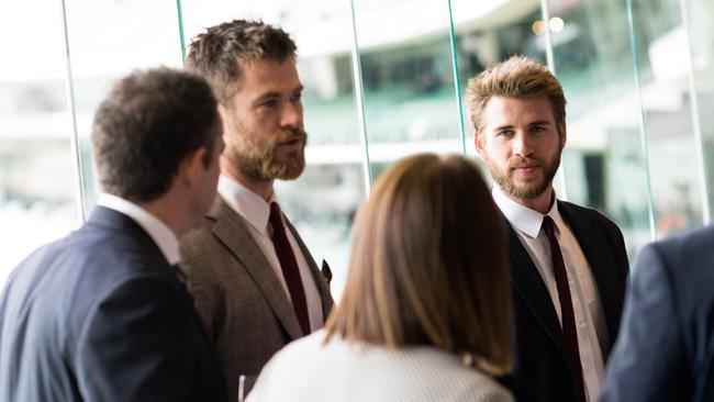 Actors Chis and Liam Hemsworth in the Olympic Room of the MCG during the AFL Grand Final. Pic: AFL Media