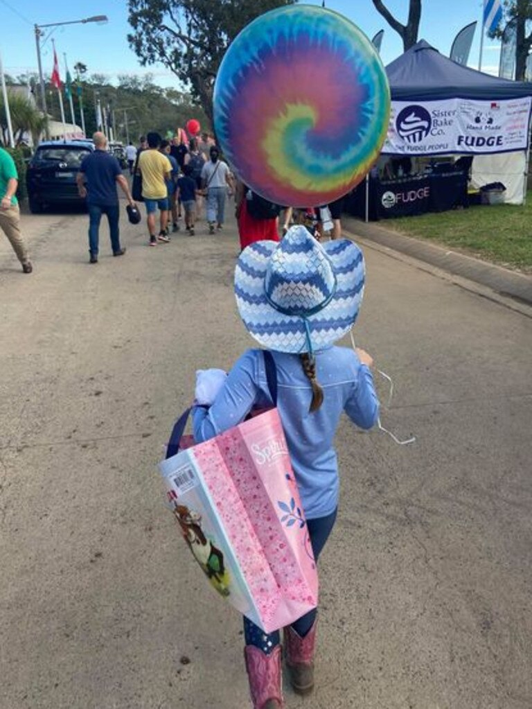 Lilli Jones, 8, and her mother Krystina are on the hunt for a silver bangle with floated away with a helium balloon at the Toowoomba Show.