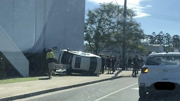 Three people have been taken to hospital after a two-car crash outside Hinkcler Central Shopping Centre.