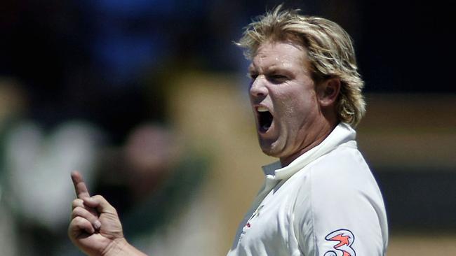 Shane Warne, bowling for Australia, celebrates after claiming the wicket of England batsman Kevin Pietersen on day 5 of the second Ashes Test match at the Adelaide Oval in 2006.