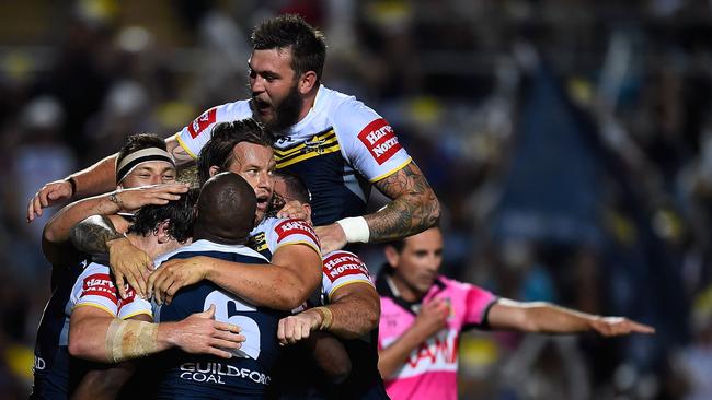 The Cowboys celebrate a try.