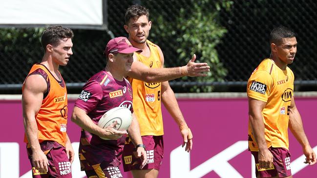 Coach Kevin Walters talking with Brodie Croft, Corey Oates, and David Mead at training. Picture: Liam Kidston