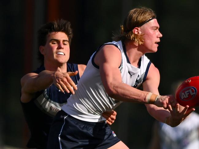 MELBOURNE, AUSTRALIA - JULY 16: Harley Reid of Vic Country handballs during the 2023 U18 Boys Championships match between Vic Country and Vic Metro at Ikon Park on June 16, 2023 in Melbourne, Australia. (Photo by Morgan Hancock/AFL Photos via Getty Images)