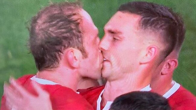 Rugby stars share awkward kiss