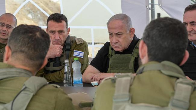 Benjamin Netanyahu and Defence Minister Israel Katz (R) during a briefing in the Netzarim Corridor. Picture: AFP.