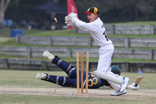 Bears keeper Banjo Jenkins takes the bails during the Queensland Junior Representative cricket Carnival at TSS last year. Picture Glenn Hampson