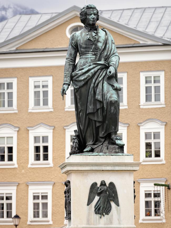 Statue of the classical composer Wolfgang Amadeus Mozart in Mozartplatz (Mozart Square) in Salzburg, Austria. The statue was unveiled on 5th September, 1842.