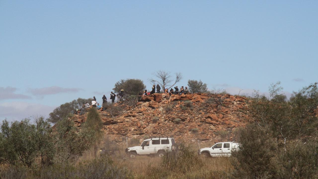 The 2025 Finke Desert Race has begun, with hundreds of punters lining the track south of Alice Springs to catch the action. Picture: Gera Kazakov