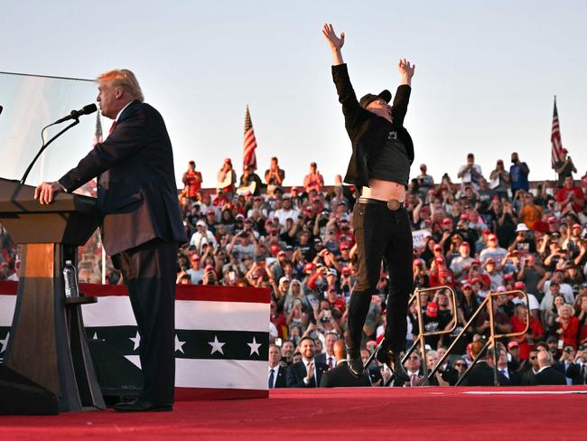 Tesla CEO Elon Musk jumps on stage as he joins former US President Donald Trump in Butler. Picture: AFP