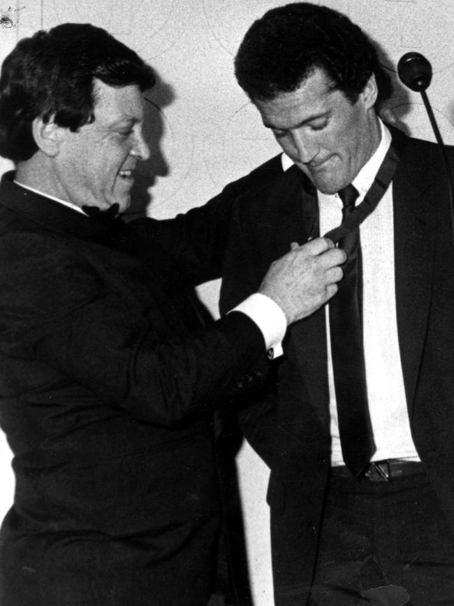 Allen Aylett presents North Melbourne's Ross Glendinning with the 1983 Brownlow Medal. Football.