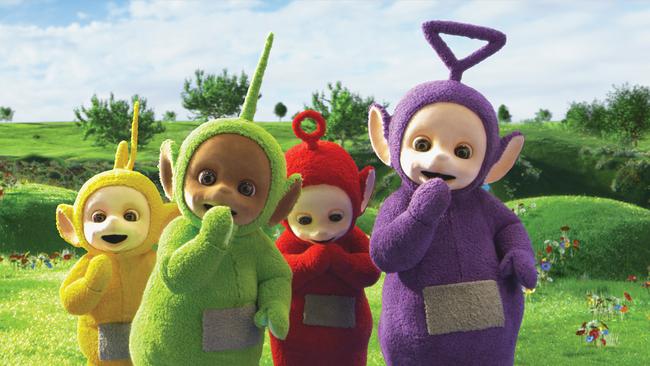 The yellow Teletubby with their green, red and purple buddies.