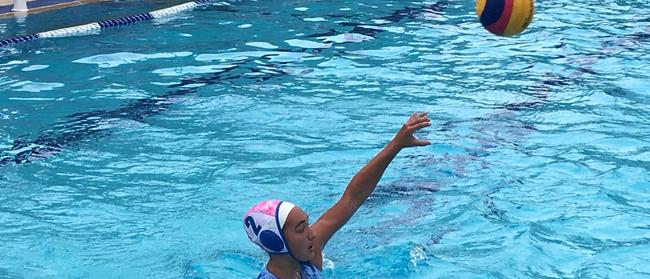 Mermaids' Molly Nasser lobs a pass during the under 16As final against All Hallows. The BWPL grand finals were held at the Valley Pool.