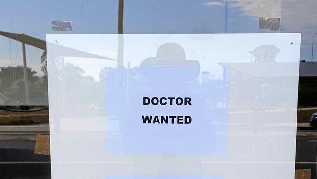 DOCTOR WANTED: Posters on the empty shop in River St in Woodburn. Picture: Susanna Freymark