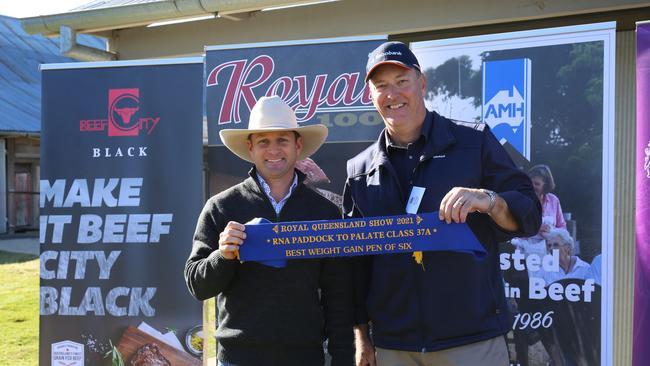 Palgrove Pastoral Company‘s Ben Noller accepting the first place ribbon from Rabobank’s Mal Porter at the Paddock to Palate weight gain stage. Photo: Contributed