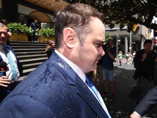 Ben McCormack leaves court after being doused with what appeared to be water and spit. Picture: AAP