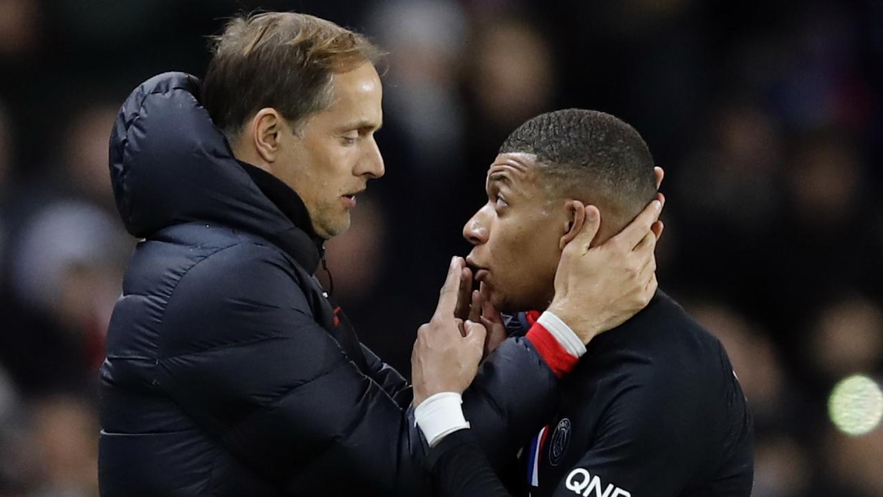 Kylian Mbappe, talks with PSG's head coach Thomas Tuchel.