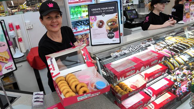 Donut King franchisee Joanne Gee with the isolation packs for families to decorate donuts at home.