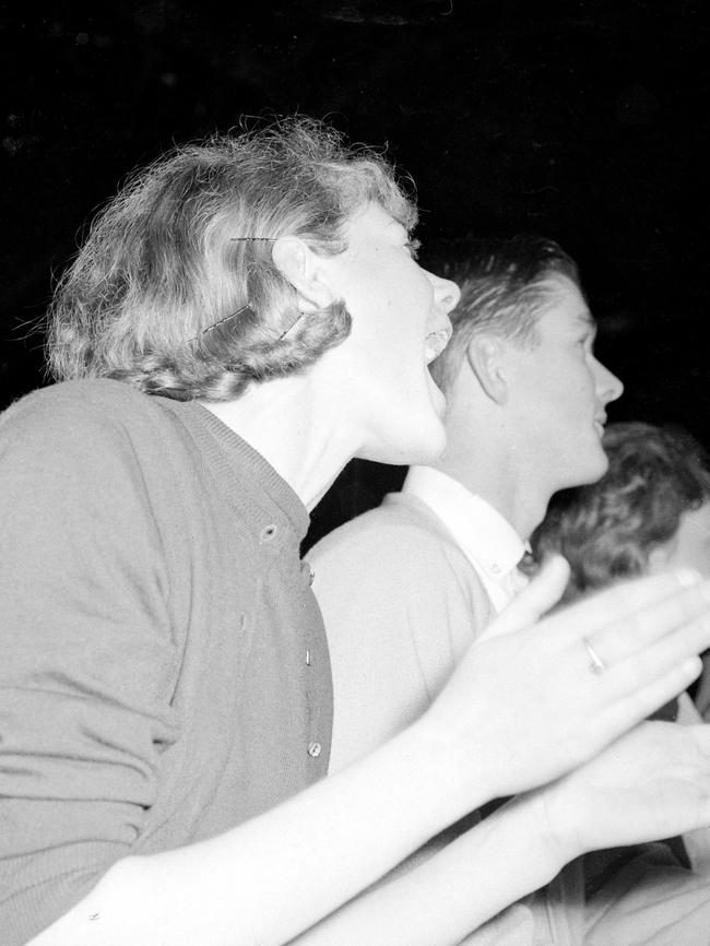 Screaming fans cheer on the Fab Four at Festival Hall. Picture: Herald Sun Image Library