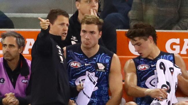 Blues head coach Brendon Bolton coaches from the bench as Harry McKay and Liam Stocker look on. Picture: Scott Barbour/Getty Images