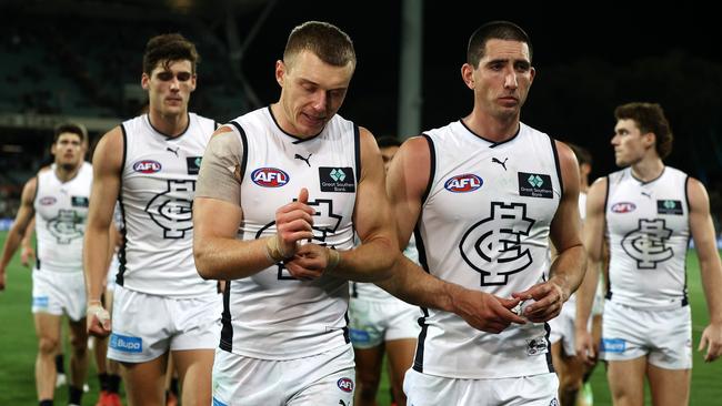 Patrick Cripps leads the shellshocked Blues off Adelaide Oval. Picture: Michael Klein