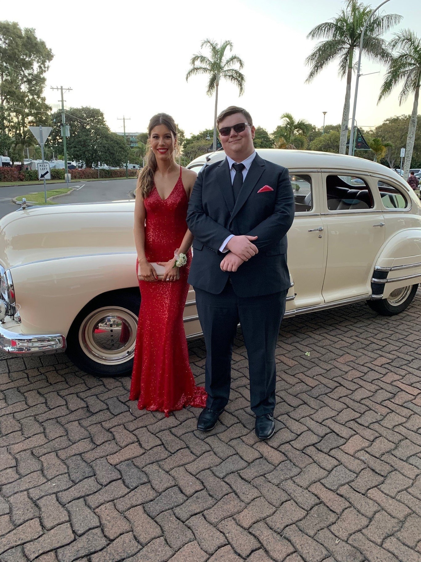 Mascha Bosnjak and Aiden Perrier arriving at the formal in style in a classic car.