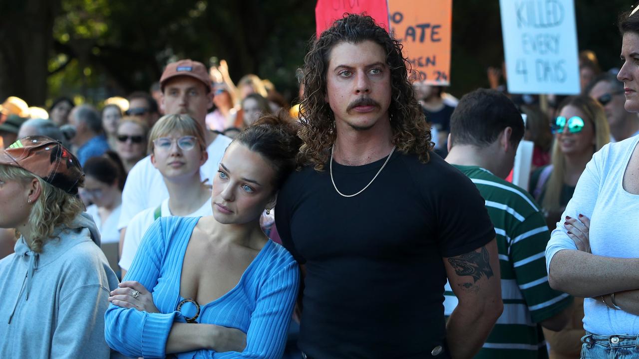 SYDNEY, AUSTRALIA - APRIL 27: Abbie Chatfield and Adam Hyde join demonstrators during a national rally against violence towards women in the central business district CBD) on April 27, 2024 in Sydney, Australia. Australians around the country turned out in large numbers to call for an end to gender-based violence, highlighted in a series of recent attacks on women that have forced state governments into action on the issue. (Photo by Lisa Maree Williams/Getty Images)