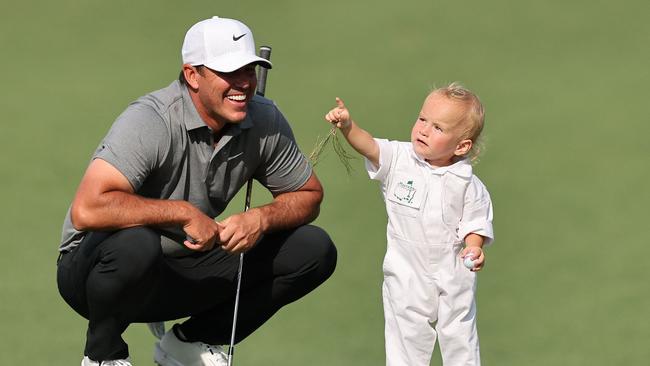 Koepka has dominated in major championships, including multiple PGA and U.S. Open titles. His lighthearted moment with his son added a personal touch to the festivities. Picture: AFP