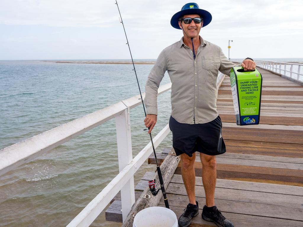 Councillor Zane O'Keefe with one of the new tackle bins.