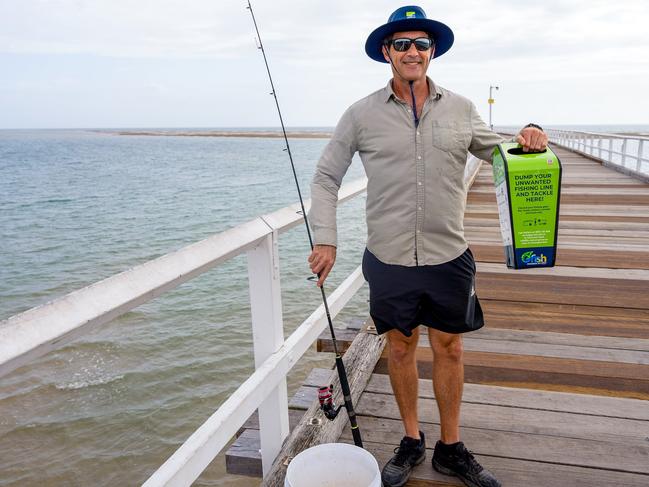 Councillor Zane O'Keefe with one of the new tackle bins.