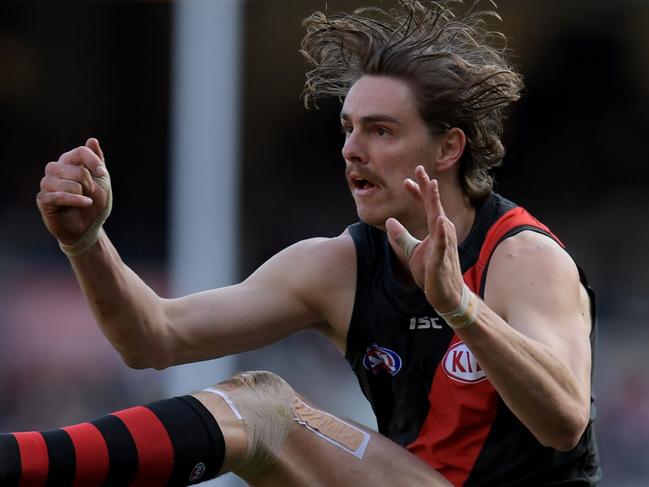 Joe Daniher of the Bombers attempts a goal kick during the Round 20 AFL men's match between the Essendon Bombers and the Carlton Blues at the MCG in Melbourne, Saturday, August 5, 2017. (AAP Image/Tracey Nearmy) NO ARCHIVING, EDITORIAL USE ONLY