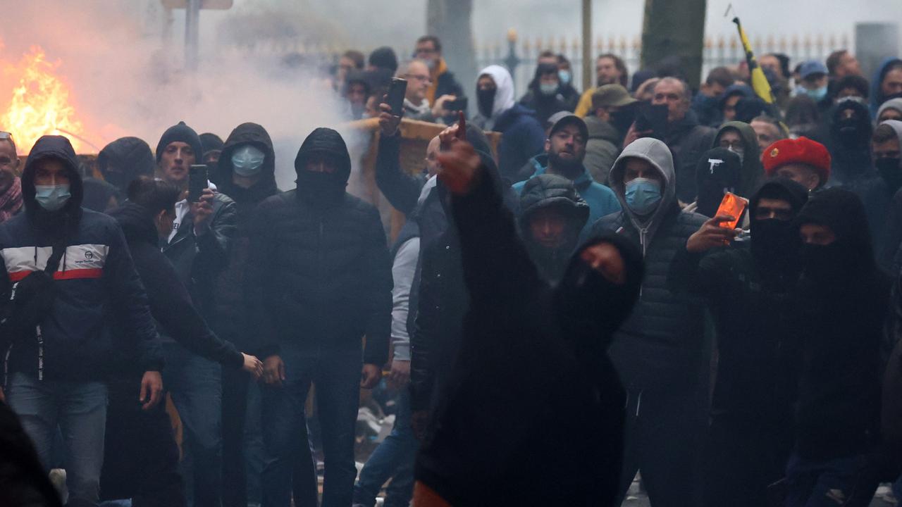 A protester throws stones towards riot police. Picture: Kenzo Tribouillard/AFP