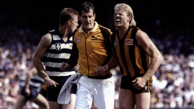 Dermott Brereton feels the pain moments after he was crunched in the 1989 grand final. Picture: Supplied