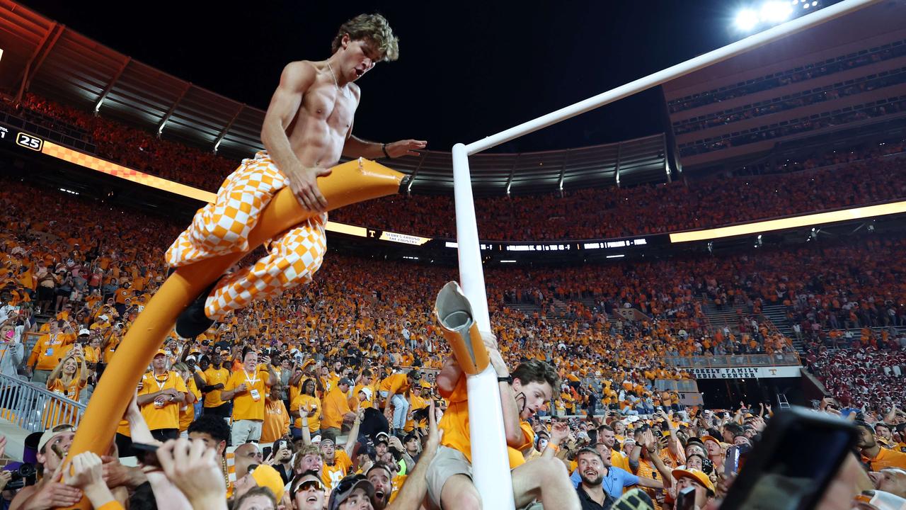 Tennessee Volunteers fans tear down the goalpost after the Tennessee Volunteers defeated the Alabama Crimson Tide. Donald Page/Getty Images/AFP