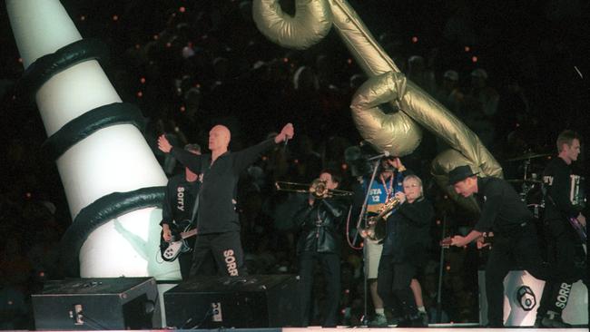 Midnight Oil performing at the closing ceremony of the Sydney Olympic Games on October 1, 2000. Picture: Martin Philbey