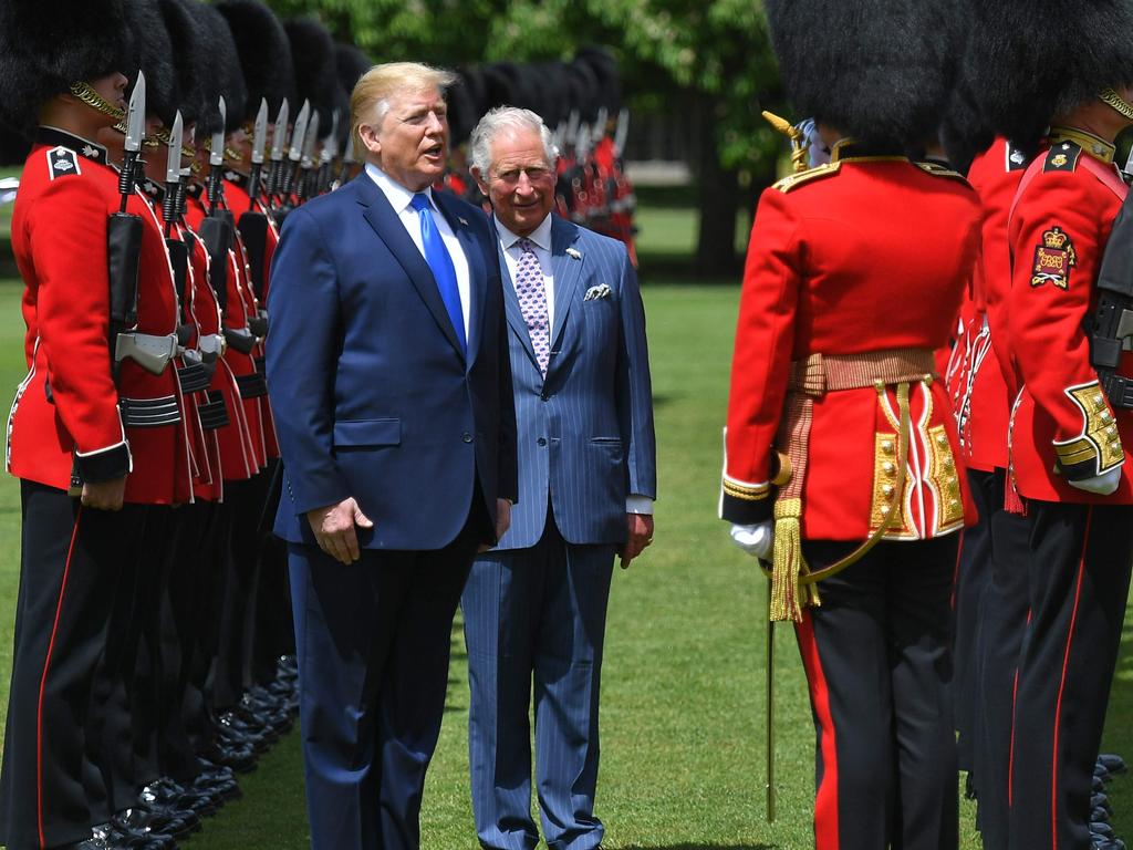 Mr Trump chats enthusiastically as he and Prince Charles inspect an honour guard during the welcome ceremony at Buckingham Palace. Picture: Mandel Ngan / AFP