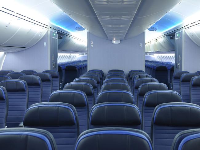 787 dreamliner commercial airplane cabin interior with blue leather seats