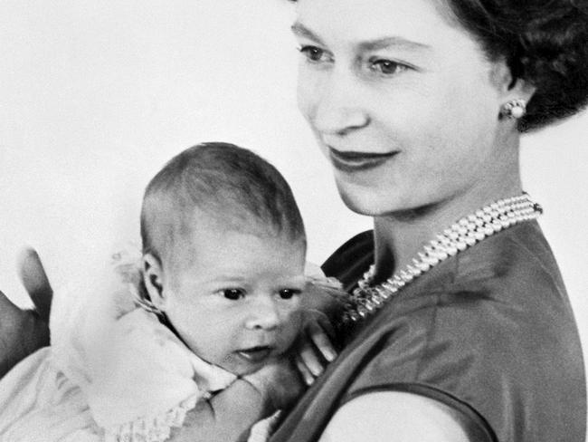 One of the first pictures of the newborn Prince Andrew shows the baby in the Queen Elizabeth II's arms, 22 March 1960 in Buckingham Palace. The name of the Prince, born 19 February 1960, was still unknown as the picture was taken. Picture: AFP/CENTRAL PRESS.