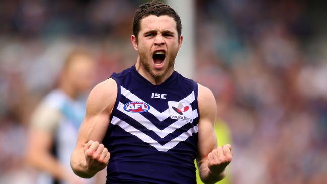 PERTH, AUSTRALIA - AUGUST 30: Hayden Ballantyne of the Dockers celebrates a goal during the round 23 AFL match between the Fremantle Dockers and the Port Power at Patersons Stadium on August 30, 2014 in Perth, Australia. (Photo by Paul Kane/Getty Images)