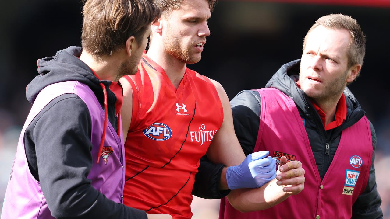 ADELAIDE, AUSTRALIA - MAY 07: Jordan Ridley of the Bombers taken from the ground with possible concussion during the 2023 AFL Round 08 match between the Port Adelaide Power and the Essendon Bombers at Adelaide Oval on May 7, 2023 in Adelaide, Australia. (Photo by Sarah Reed/AFL Photos)